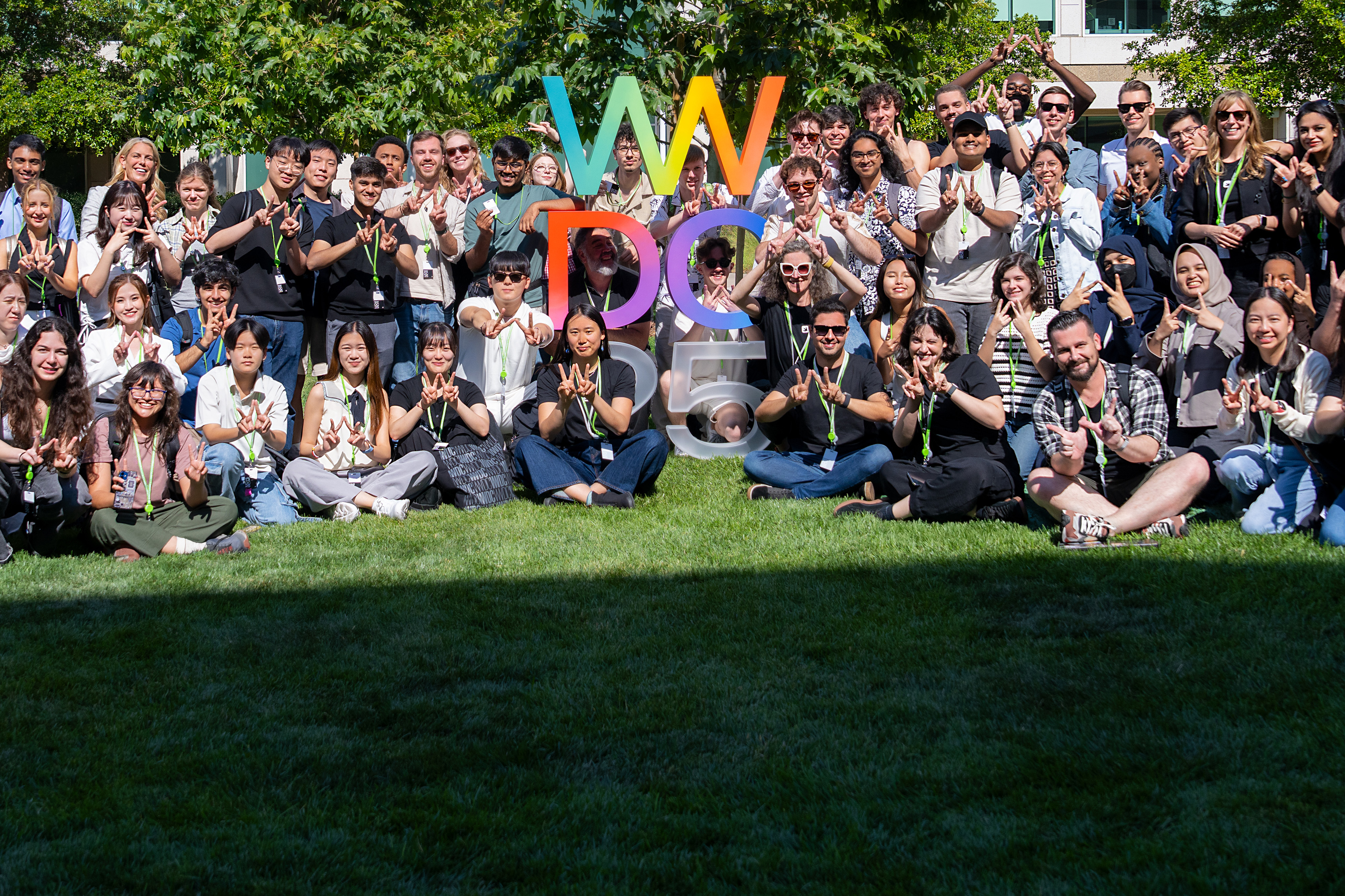 2025 Swift Student Challenge Winners posing outdoors at WWDC.